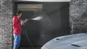 Man cleaning garage door