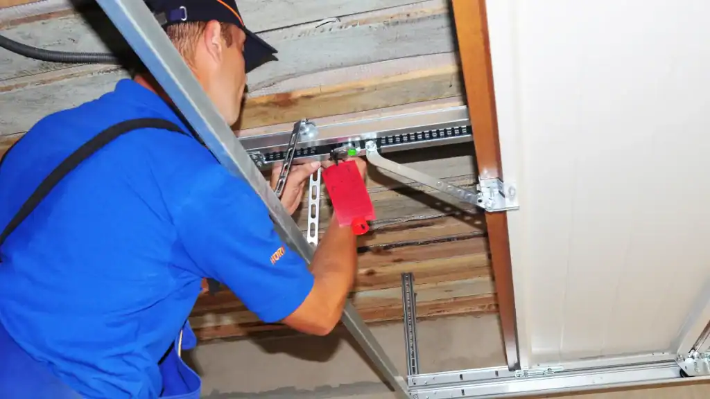 Technician performing a garage door replacement